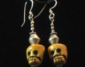 Earrings: hand-carved bone skull beads