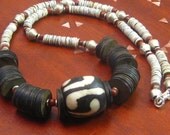 Necklace: African batik bead with coconut shell and mother of pearl heshi