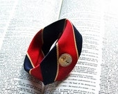 Necktie Wristcuff in scarlet red and navy with clown stripes and vintage metal button