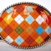 Jada Belt Buckle - Orange Argyle - Oval Wearable Art