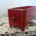 RESERVED FOR RONYvintage painted red sewing machine drawer with spool legs