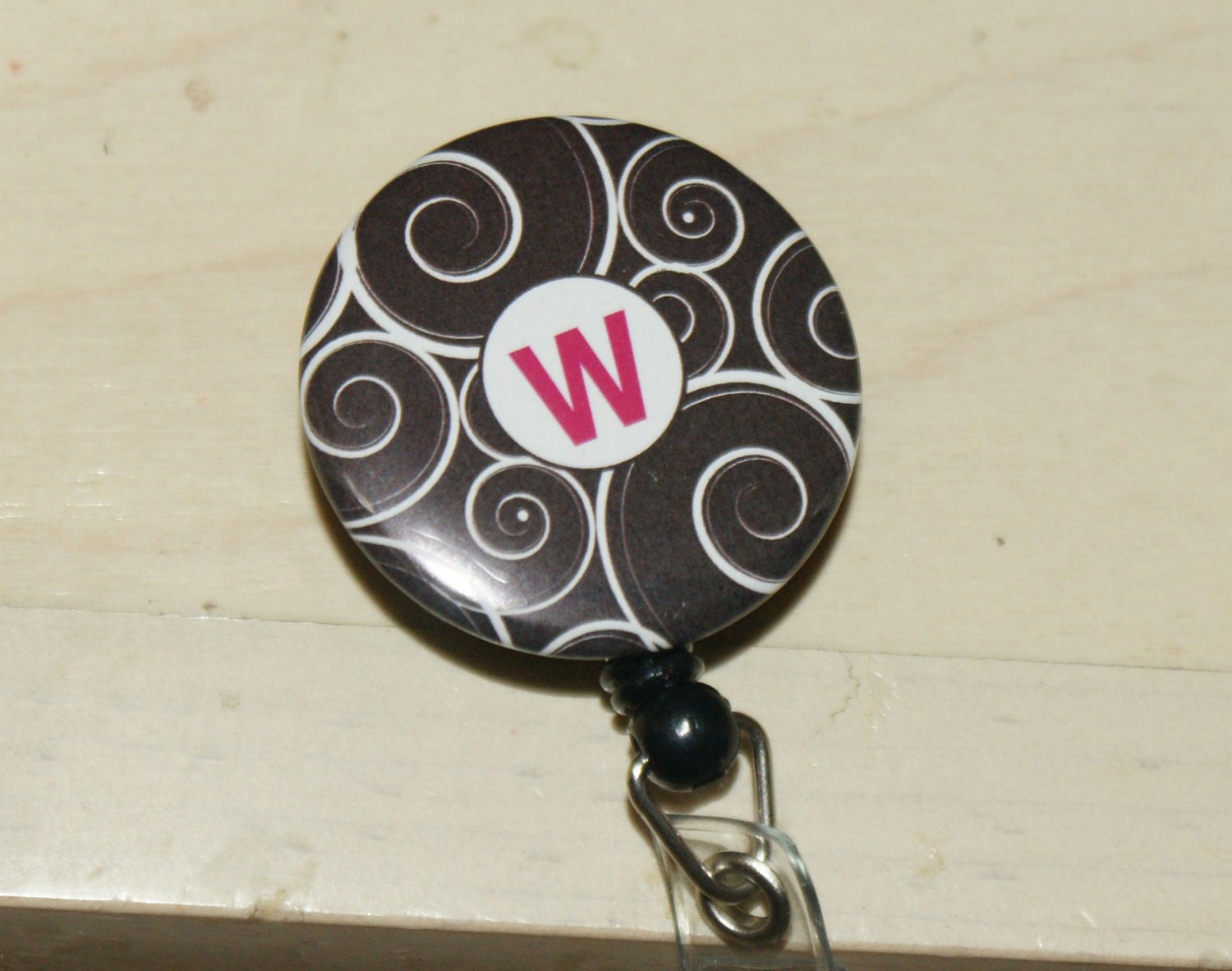 ID reel with MYLAR covering....Black Swirl ...CHOOSE your letter