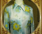 70s blue and yellow floral shirt. big collar.