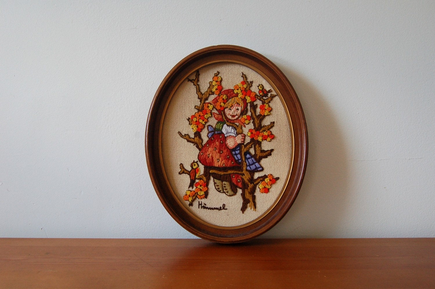 SALE. vintage framed HUMMEL needlepoint.
