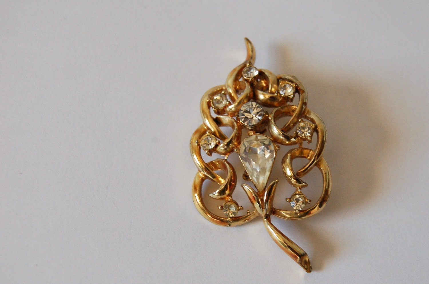 vintage gold tone LEAF brooch with rhinestones