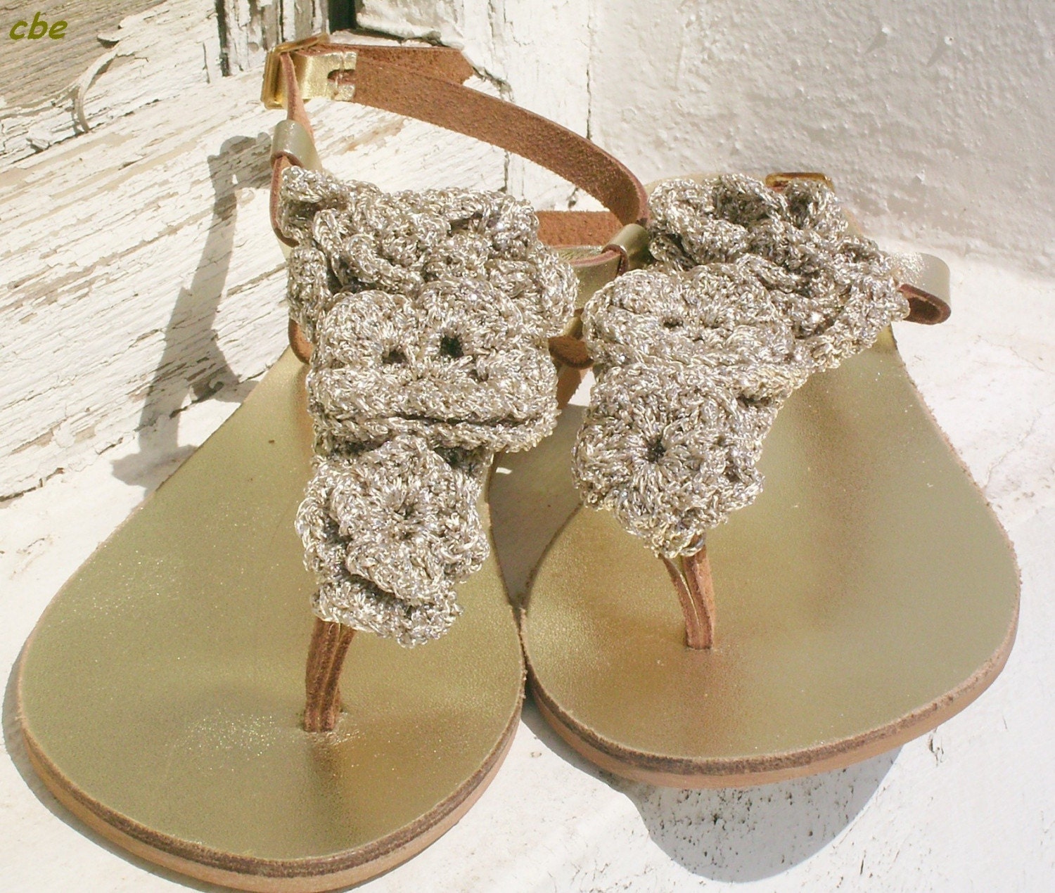 Gold sandals with crochet flowers