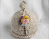 Baby or toddler girl knit hat with lollipop applique.  Sizes newborn to big kid available.