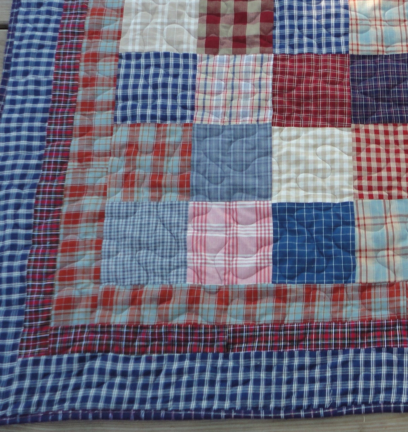 Queen size quilt made with red, blue , cream plaids