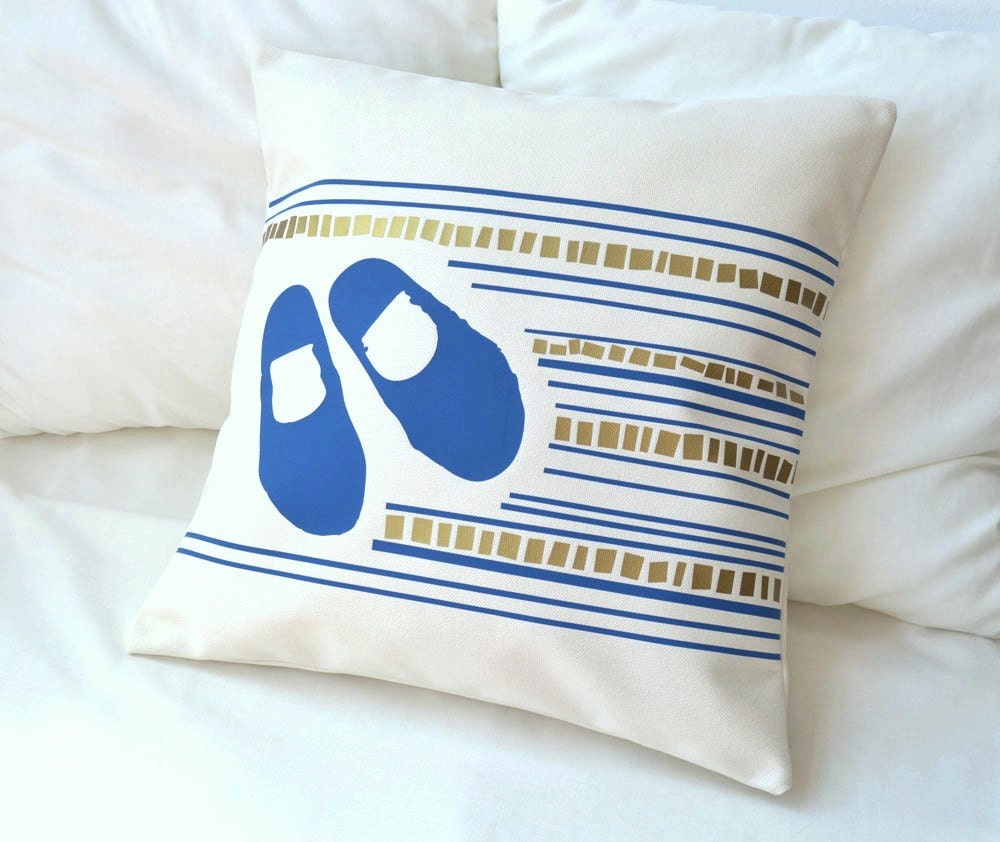 Natural white cotton pillow cover with design of little shoes in Mediterranean blue over mosaic design with envelope closure 18 x 18 inches