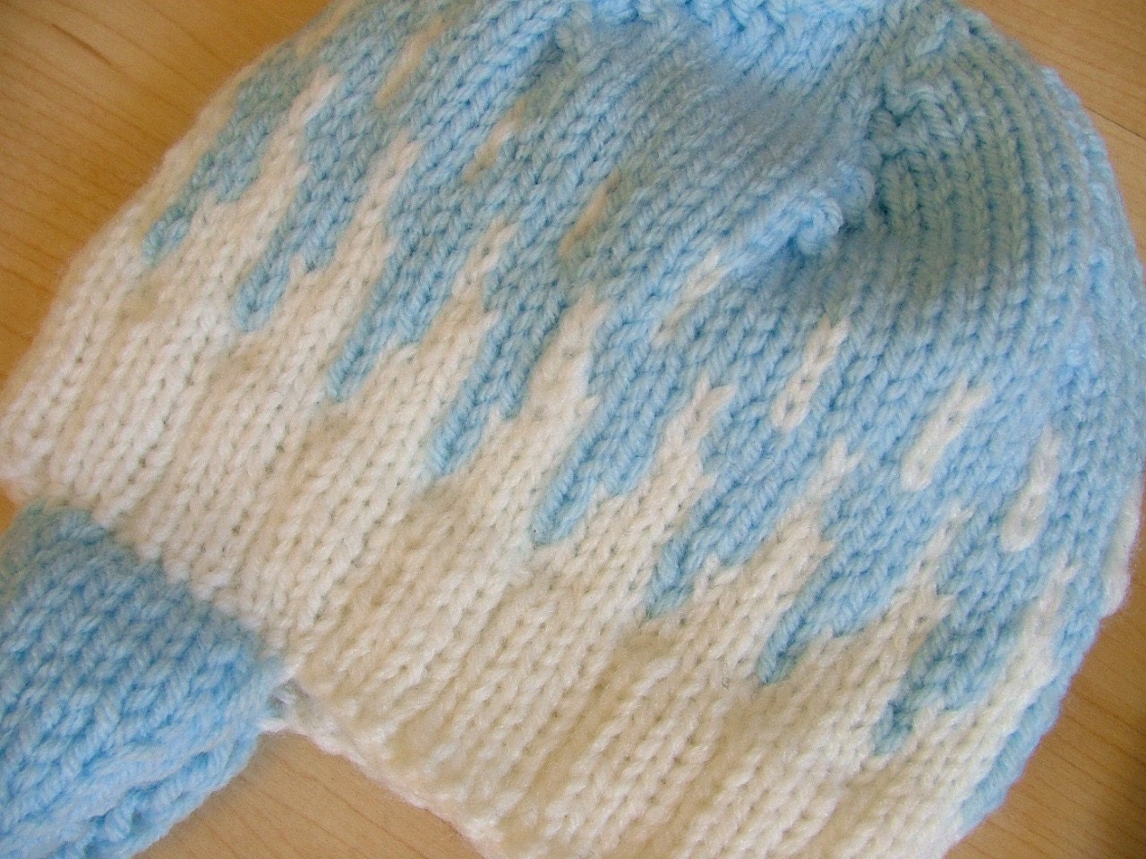 Hand-knit blue and white infant cap