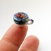 teacup of miniature escheverias in 12th scale