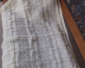 Knitted pale yellow baby blanket,  with sparkling threads, for a  girl