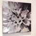 Wall clock image of Dhalia on Aluminum -Wholesale pricing.