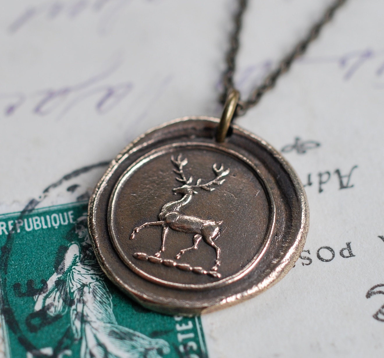 stag reindeer wax seal necklace in bronze... peace and harmony