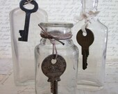 Three Vintage Glass Bottles with Skeleton Keys