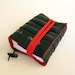 Recycled journal, bike inner tube, blank pages, red linen and red  elastic band closure, small.
