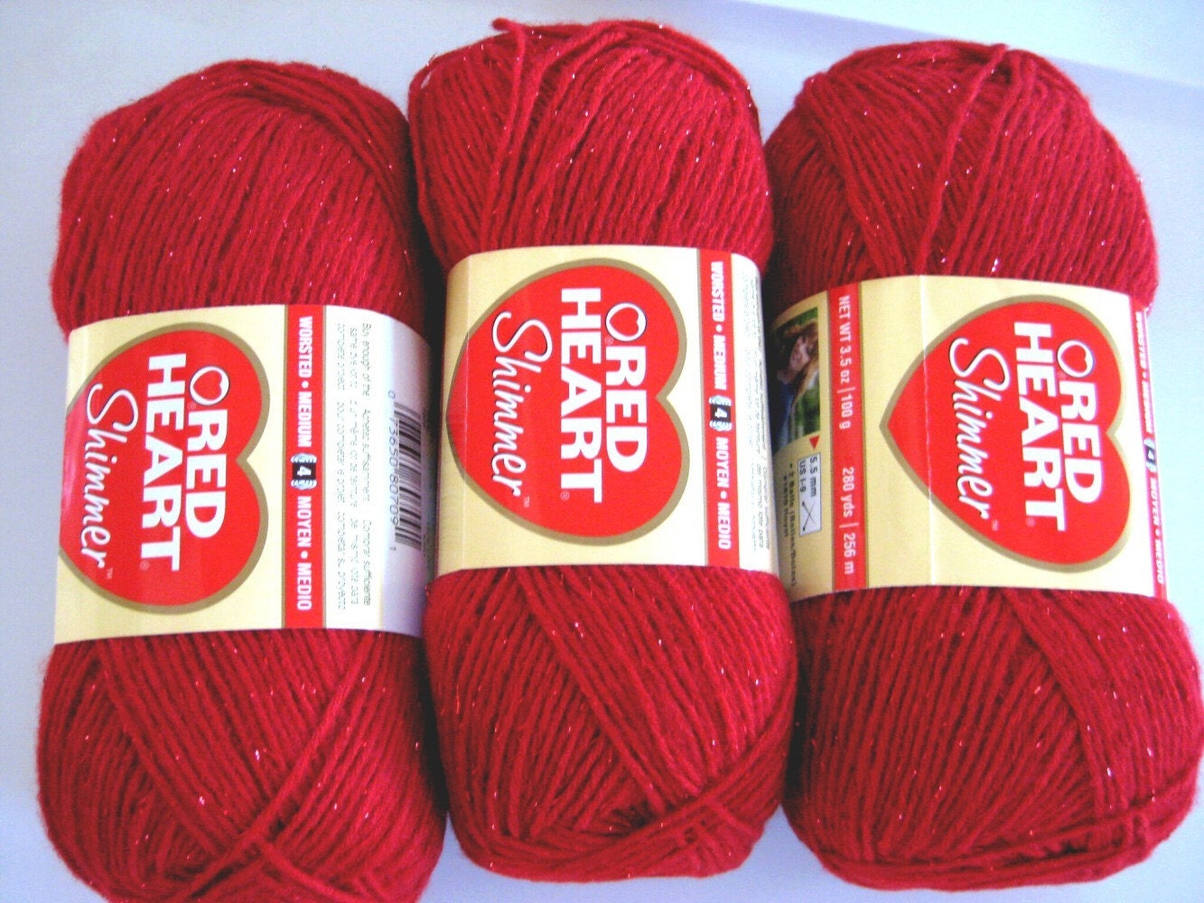 Red Heart Shimmer yarn,  red with red metallic thread, worsted weight, red sparkle yarn