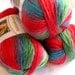 Boutique Unforgettable yarn in Parrot, bright shades of red, green, blue worsted weight, Red Heart Boutique
