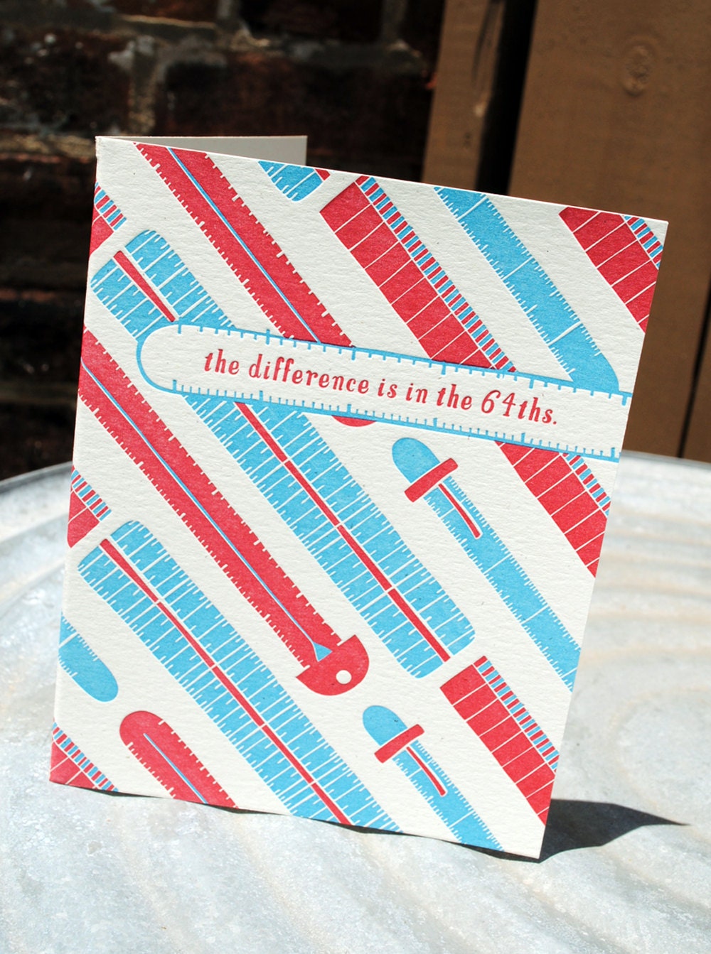 the difference is in the 64ths. letterpress printed card.