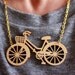 Wooden Bicycle Necklace, Laser cut in Birch wood on gold plate chain.