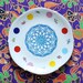Super festive serving set of one very large and four smaller (cake/breakfast) plates
