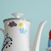 Large little village and peacock teapot