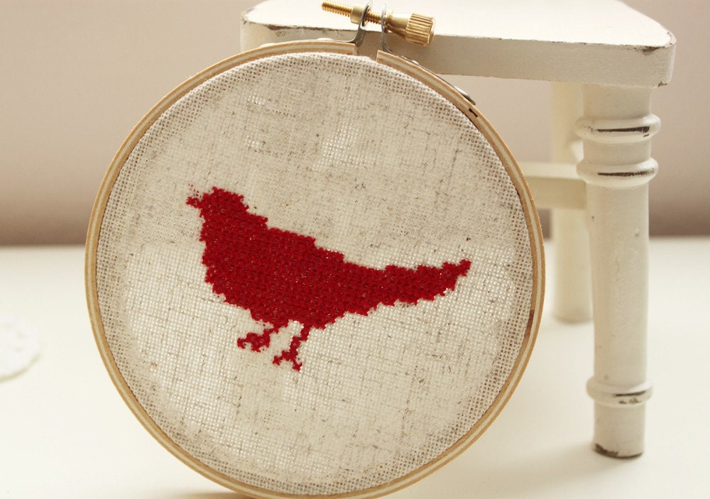 Completed Red Bird Silhouette Cross Stitched in Embroidery Hoop