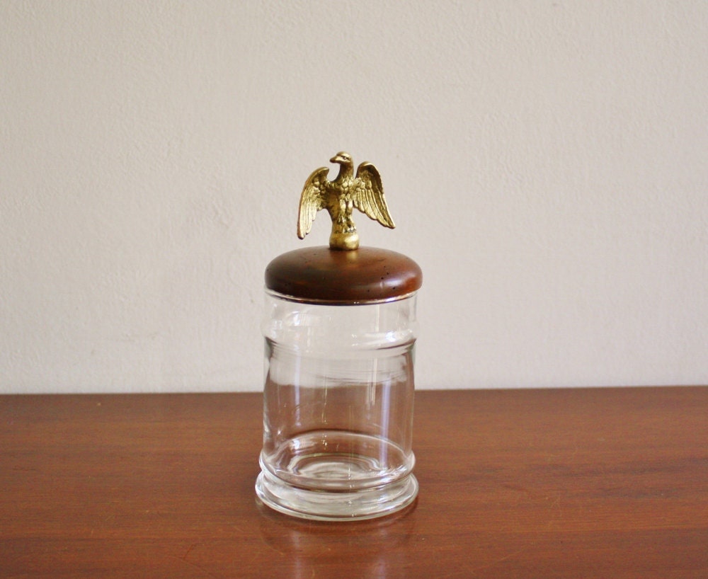 Vintage glass jar with wooden lid and brass eagle finial
