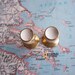 2 small vintage mid century distressed brass metal knobs with white centers includes hardware