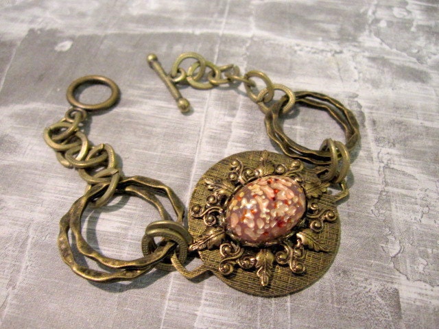 Bold Bracelet with Oval Pink Cabochon and Twisted Rings