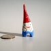 Mini ceramic garden gnome for pocket travel or potted plants