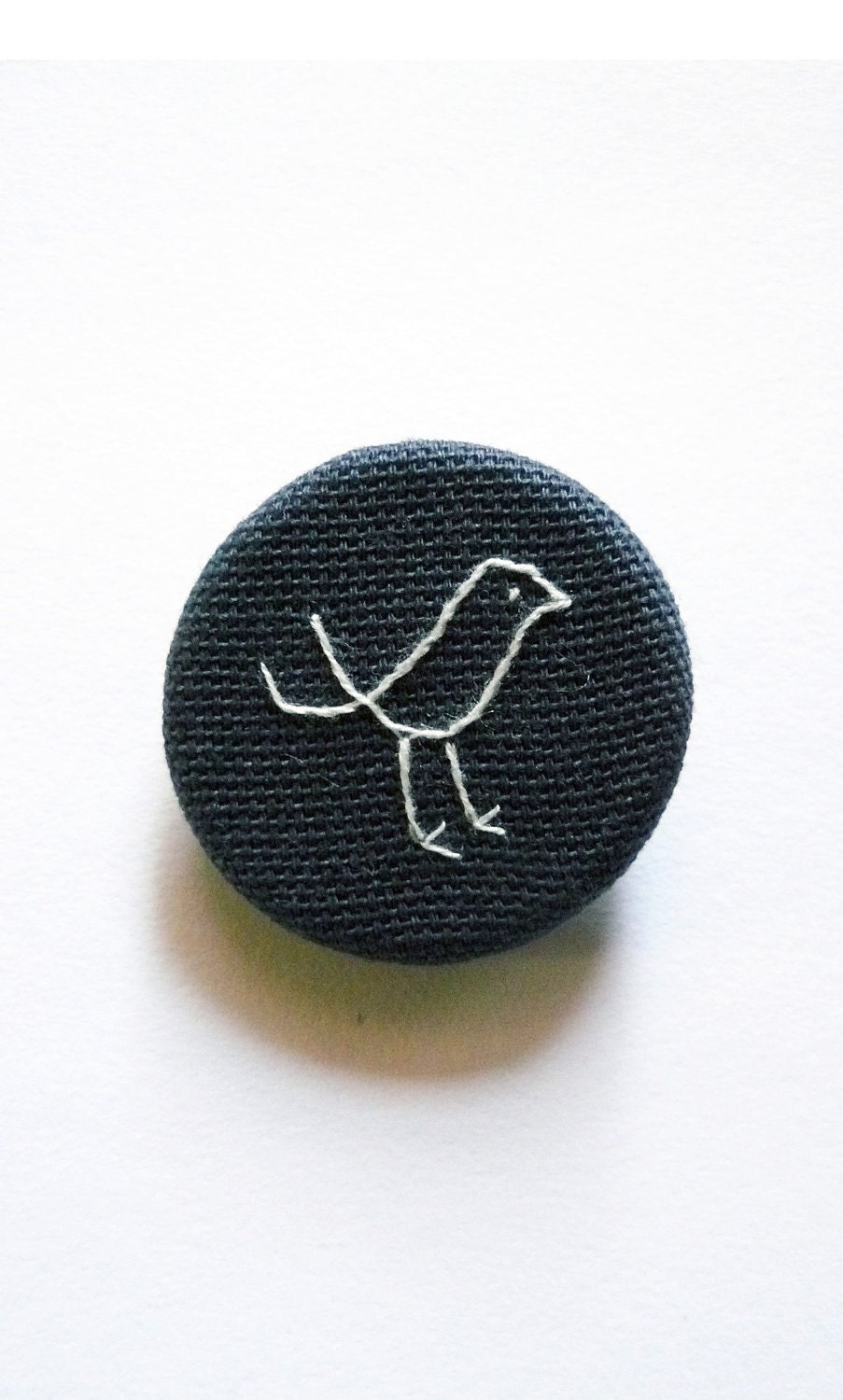 Navy Blue Bird Brooch. hand embroidered pin badge on indigo organic cotton blend fabric