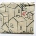 zipper pouch, purse. red fox squirrel and bird embroidery. navy blue houses on taupe sustainable linen cotton blend designed fabric.