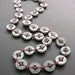 stitched red and green button necklace with sterling silver