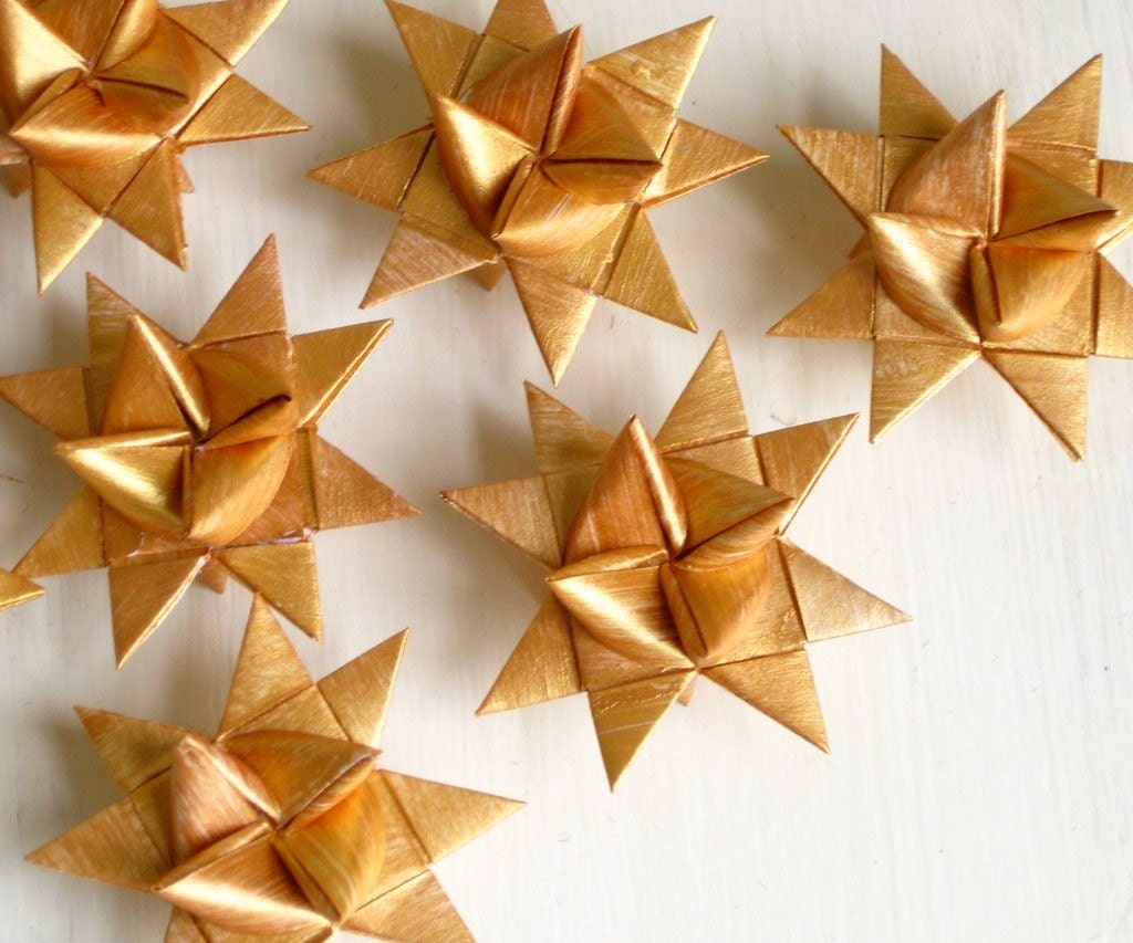 Christmas stars three golden origami folded 3D s