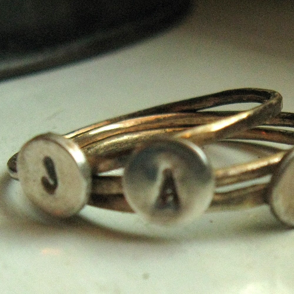 Solid gold and sterling initial rings