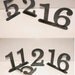 metal table numbers