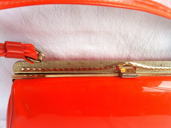 Unique shiny orange patent vinyl frame style handbag with black satin lining and gold clasp, vintage 1960's  - Free Shipping