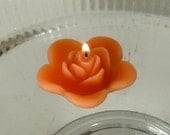 12 Coral floating rose wedding candles for table centerpiece and reception decor.