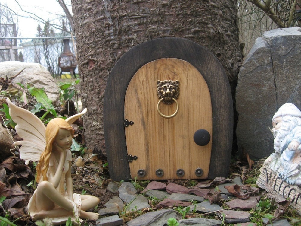A Fairy door / Gnome door that OPENS.  9 inch rounded Gnome / Fairy door with lion knock.