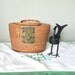 Vintage Basket Nantucket style basket with two swing handles and a fish clasp