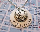 silver travel necklace with globe charm