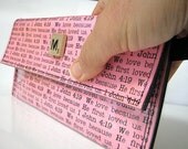 Personalized clutch wallet.  You pick wording and Scrabble tile and color card stock.  Under 15