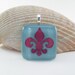 Fused Glass Fleur de Lys Copper Inclusion Pendant - Light Blue