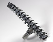 djed. rattlesnake spine ring.