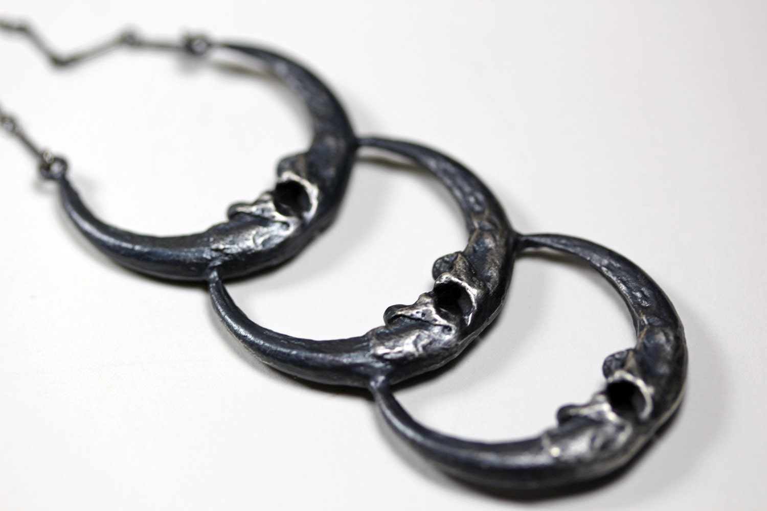 new moon. triple owl talon crescent necklace.