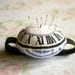 Wrist pin cushion with watch face screen print