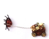 Ladybug pulling flower cart brooch, unusual double pin - otherworlds