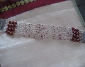 Knitted  wire bracelet in  sterling silver and red