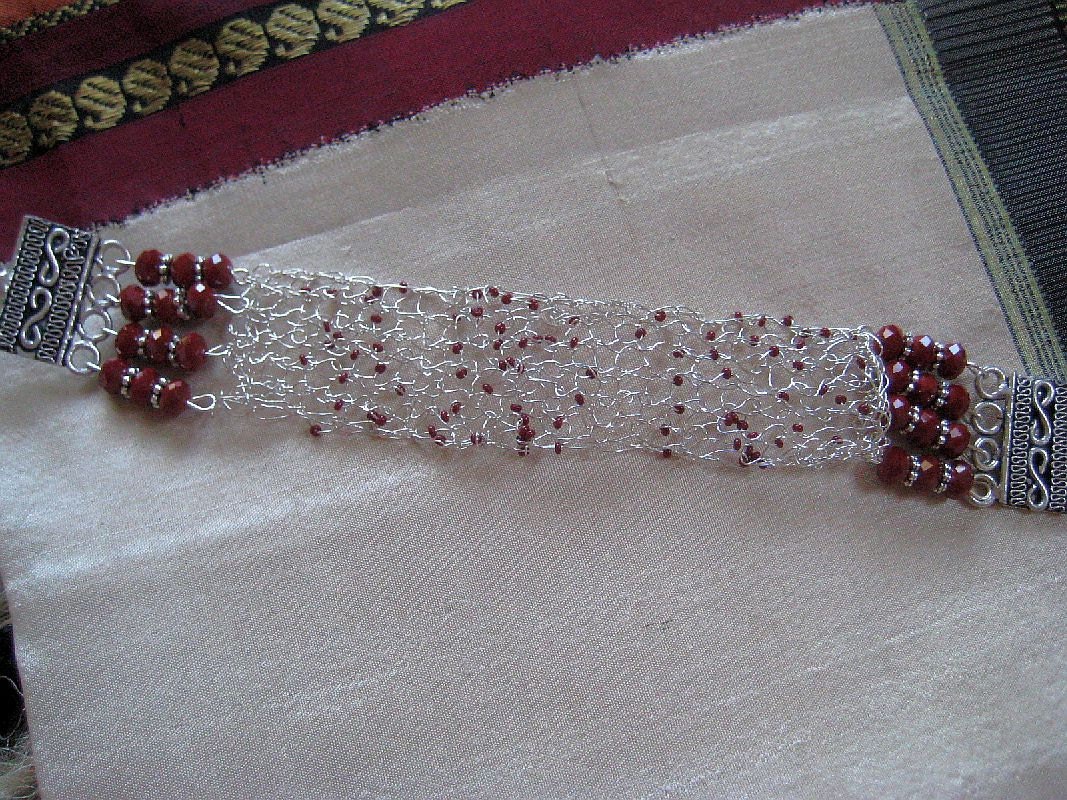 Knitted  wire bracelet in  sterling silver and red